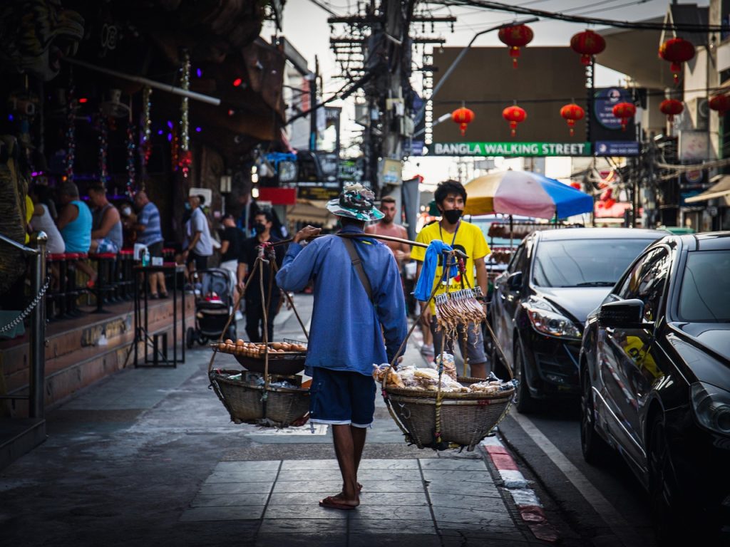 people, food vendor, street, city, food peddler, street food, market, crowd, walking, shopping, walk, sidewalk, outdoors, urban, travel
